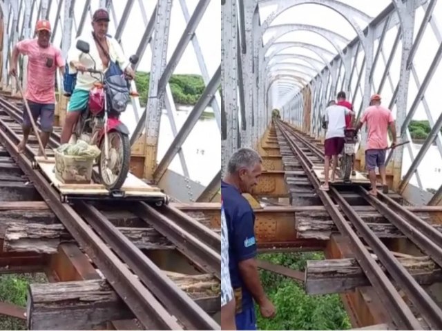 Com estrada interditada aps chuvas, populao improvisa tbua com rodas em trilho de ponte desativada para se locomover em Senador Pompeu