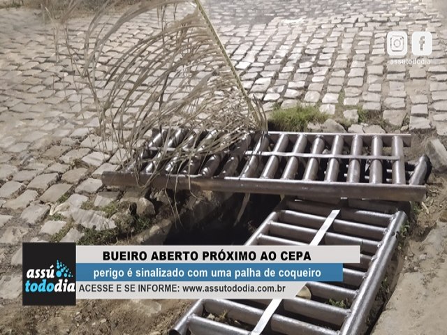 Perigo: Bueiro aberto prximo ao CEPA  sinalizado com uma palha de coqueiro 